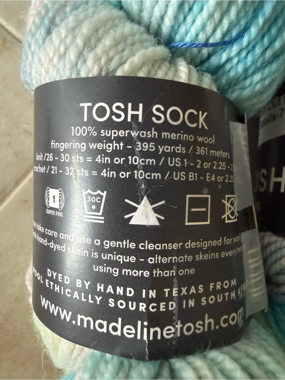 Madelinetosh Hand-Dyed Yarn Skeins in Aqua and Pale Blue